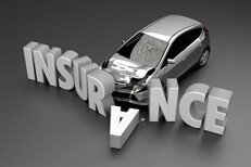 Black and white collision concept Black and white image of car crashed into insurance letters with front end damage