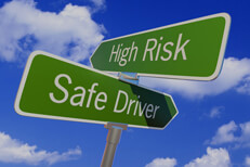 High risk driver street sign Street sign with arrows reading High Risk and Safe Driver pointing in opposite directions