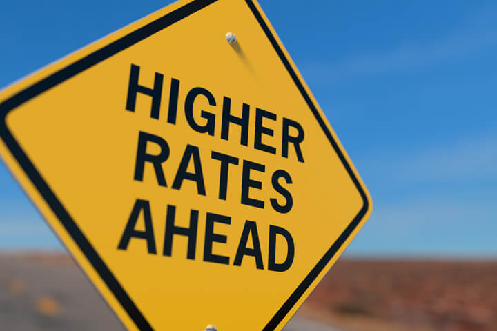 Road sign indicating higher auto insurance rates