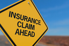 Insurance claim ahead road sign Yellow road sign reading Insurance Claim Ahead