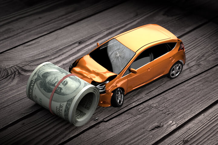 Car with front end damage crashed into roll of money car insurance concept
