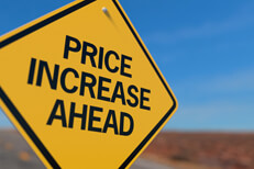 Price increase ahead road sign Yellow road sign reading Price Increase Ahead concept for upcoming insurance rate increase