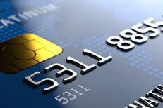 Credit card from corner Close up view of credit card from corner angle showing partial number and EMV chip