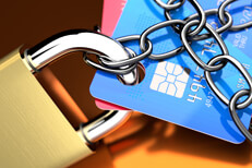 Credit lock services Close up photo of credit cards with padlock and chains
