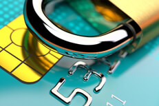 Teal credit card with padlock Close up photo of EMV chip with portion of padlock visible