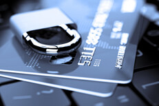 Blue tone credit cards Credit cards on keyboard with padlock in shades of blue