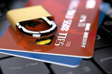 Credit cards on keyboard locked Two credit cards on keyboard with small padlock lying on top