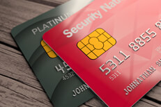 Top view of two credit cards on weathered wood plank background