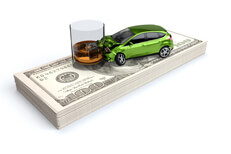 DUI crash concept on stack of cash Car crashed into whiskey glass DUI accident on stack of cash illustrating the high cost of DUI