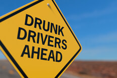 Drunk drivers ahead road sign Yellow road sign reading Drunk Drivers Ahead DUI concept image