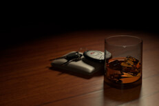Whiskey glass on bar with keys and wallet Drunk driving concept showing a whiskey glass on bar with wallet and car keys another view
