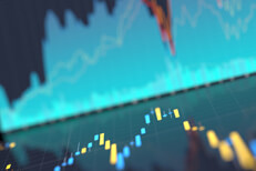 Stock price charts reflection Computer screenshots of area and candlestick charts for stock prices reflected