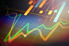 Line and candlestick charts showing stock prices with lens flare and overlay