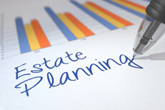 Estate planning with chart Paper with investment returns chart with Estate Planning words written beneath with ballpoint pen