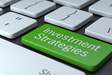 Investment Strategies keyboard key Computer keyboard with large green Investment Strategies key concept for online investment research
