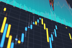 Stock price charts Computer screens showing stock price area chart, trading volume, and candlestick price changes
