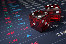 Stock ticker with two dice representing the risk involved with choosing investments