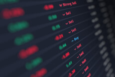 Stock listings with blur Stock ticker listings with focus on buy/sell recommendations with other information blurred