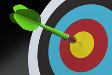 Dart in center of target Green dart in center of colorful target on dark background
