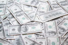 Thousands of dollars scattered Thousands of dollars in $100 bills scattered on ground