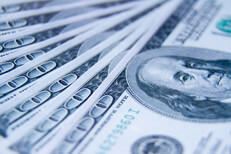 Fanned out $100 bills $100 bills evenly fanned out