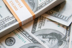 Lots of money Banded bundle of $10,000 on top of other $100 bills