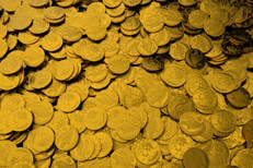 Large pile of gold coins Large pile of gold coins representing treasure, wealth, riches, or investment