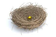 Concept image of small golden egg in nest representing not enough or lack of retirement savings