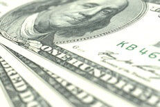 Perspective Ben Franklin bills Image showing three 100 dollar U.S. bills close up at angle with short depth of field