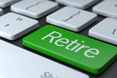 Retire keyboard key Computer keyboard with large green RETIRE button concept for retirement or online investment