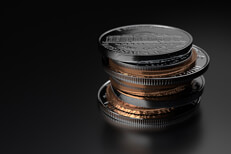 Small stack of coins Small stack of assorted U.S. coins on dark shiny background