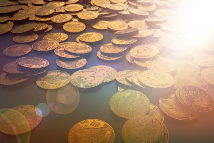Random drop of U.S. gold coins with strong light flare effect