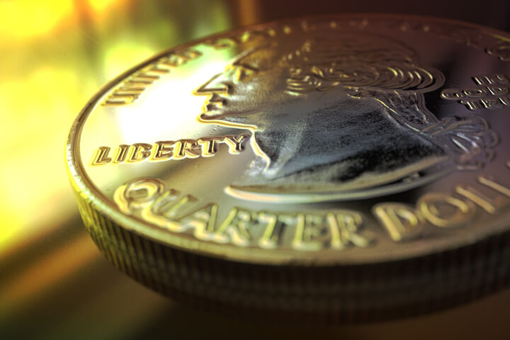 U.S. quarter coin on shiny surface reflecting window