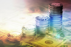 Quarters stacked lighting effect Increasing stacks of U.S. quarters on one hundred dollar bills with hard sun flare and overlay