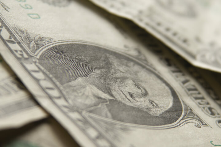 Free photo of random dollar bills at sharp camera angle