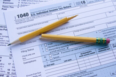 Taxes broken pencil Form 1040 and Schedule A with broken pencil illustrating tax frustration