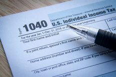 Ballpoint pen on 1040 form Ballpoint pen on IRS form 1040 with vignette