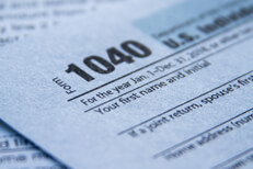 Close up of IRS form 1040 Close up photo of IRS form 1040 showing paper texture and depth of field blur