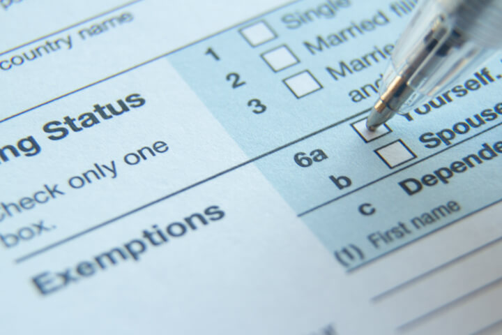 Close up photo of IRS form 1040 Exemptions fields with ballpoint pen checking the Single box