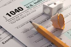 Form 1040 with pencil IRS form 1040 with yellow pencil, sharpener, and pencil shaving