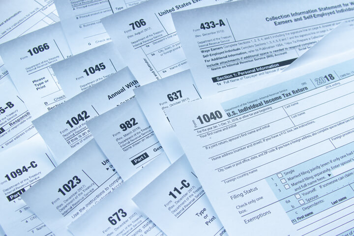 Photo showing many tax forms concept for tax reform and tax simplification