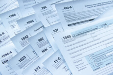 Concept for tax simplification Photo showing many tax forms concept for tax reform and tax simplification