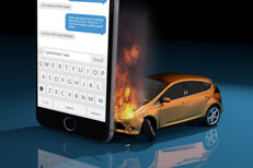 Car on fire texting while driving Image showing damage after texting while driving accident with car on fire